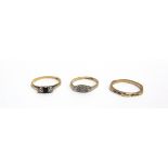 THREE GOLD RINGS comprising; an early 20th century gold, small sapphire and diamond three stone