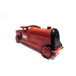 A TRI-ANG PRESSED STEEL PULL-ALONG LOCOMOTIVE scarlet, 50.5cm long; together with a Star Saving Safe