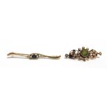 TWO EARLY 20TH CENTURY GOLD AND GEM SET BROOCHES comprising; a peridot and half pearl open scrolling