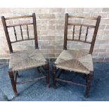 A PAIR OF ASH SPINDLE BACK CHAIRS with rush seats