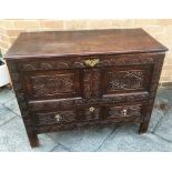 AN OAK MULE CHEST with carved decoration, 108cm wide 52cm deep 87cm high