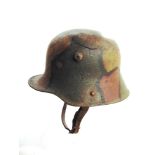 A GREAT WAR IMPERIAL GERMAN M16 STAHLHELM with some battle damage and a hand-painted camouflage