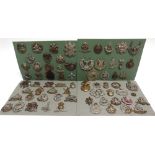 ASSORTED CAP BADGES RELATING TO REGIMENTS MOBILIZED IN 1939 comprising those for the Lancashire