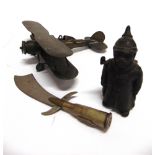 ASSORTED MILITARIA comprising a trench art brass model of a Gloster Gladiator style aeroplane,