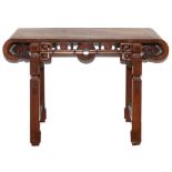 A CHINESE CARVED ROSEWOOD ALTAR TABLE 116cm wide 40cm deep 84cm high Provenance: Purchased at