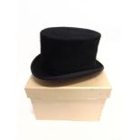 A BLACK FELT HUNTING TOP HAT by Patey of London, size 6 ¼', with cardboard hat box