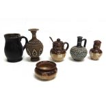 A COLLECTION OF DOULTON STONEWARE ITEMS including a silver mounted blackjack ware jug 9.5cm high;