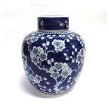 A LARGE CHINESE GINGER JAR AND COVER allover decoration of prunus blossom, underglaze blue double