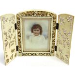 A CHINESE CARVED IVORY TRIPTYCH PICTURE FRAME the central aperture approx 6cm x 9cm with foliate