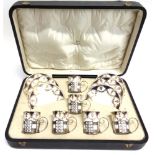 A CASED SET OF SIX SILVER MOUNTED AYNSLEY COFFEE CANS AND SAUCERS the silver mounts stamped Walker &