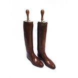 A PAIR OF BROWN LEATHER POLO BOOTS the brass topped toes engraved 'Capt. G.G. Middleton, Scots