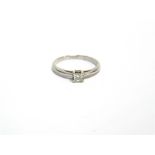 A MODERN WHITE GOLD AND DIAMOND SOLITAIRE RING the princess-cut stone approx. 0.20cts claw set in