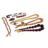 A COLLECTION OF BALTIC AMBER JEWELLERY AND VARIOUS IMITATION AMBER NECKLACES the Baltic pieces