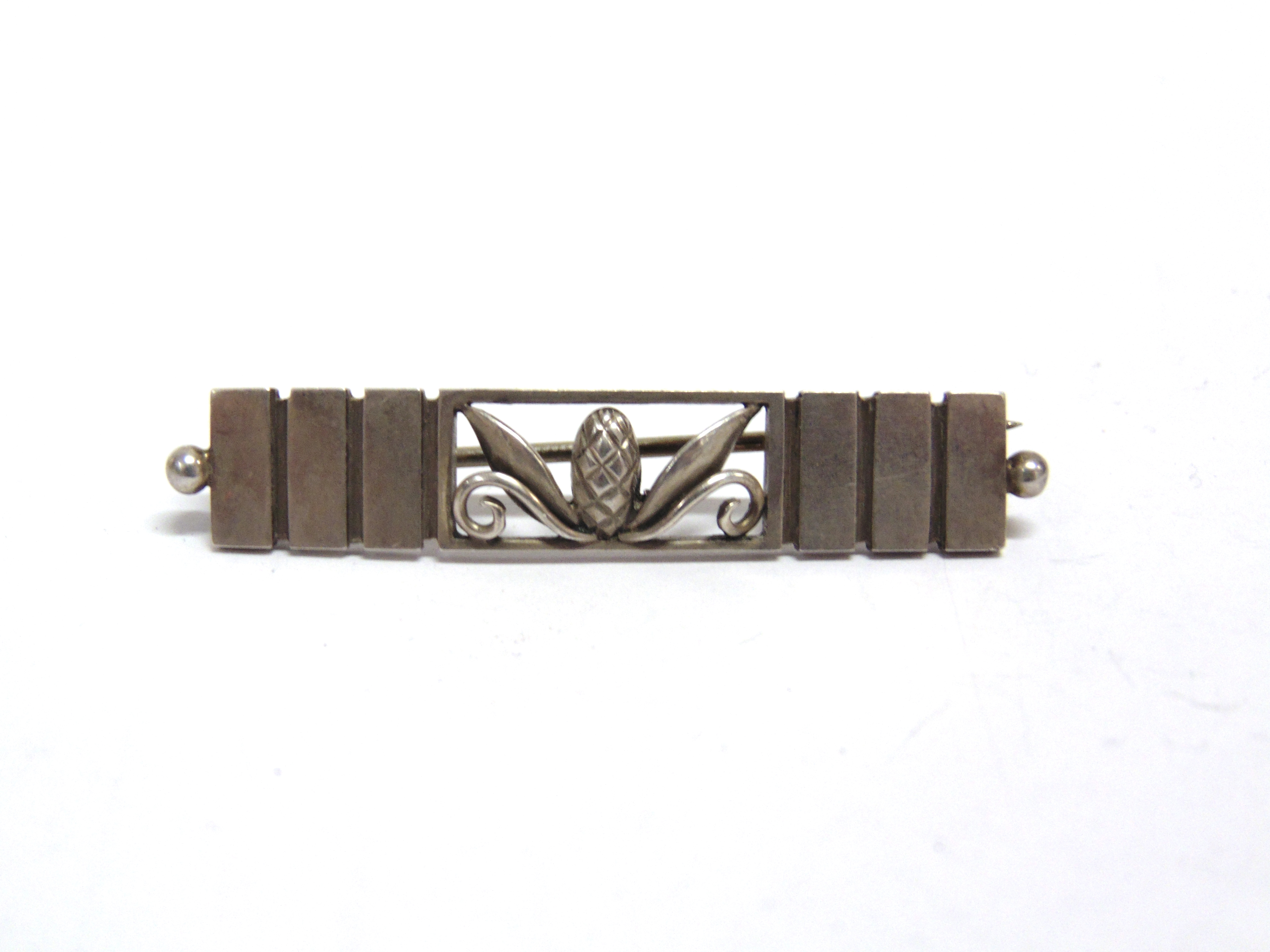 GEORG JENSEN, A MID 20TH CENTURY SILVER RECTANGULAR BROOCH with a central pineapple and leaf open