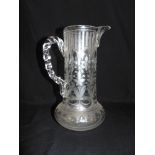 A VICTORIAN GLASS JUG with engraved and acid etched decoration, 26cm high