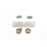 A PAIR OF SMALL OVAL CABOCHON WHITE OPAL STUD EARRINGS unmarked; and a pair of black-opal-doublet