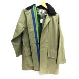 A RIDRY AQUATEX WATERPROOF JACKET and a pair of green over trousers