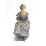 AN EARLY ROYAL DOULTON FIGURE 'THE CURTSEY' impressed to base '8.19', painted marks 'The Curtsey E.