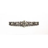 AN EARLY 20TH CENTURY DIAMOND AND PEARL BROOCH centred with a cushion-shaped old-cut diamond approx.