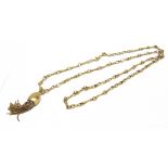 A MODERN ITALIAN GOLD NECKLACE AND A TASSEL PENDANT the necklace in the form of textured figure-of-