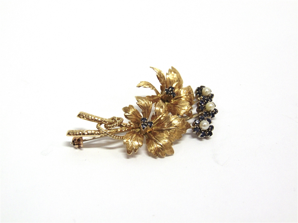 A CONTINENTAL SAPPHIRE AND CULTURED-PEARL SPRAY BROOCH in the form of two leaf cinquefoils with