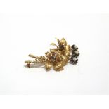 A CONTINENTAL SAPPHIRE AND CULTURED-PEARL SPRAY BROOCH in the form of two leaf cinquefoils with