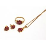 A 9CT GOLD AND RUBY FLOWER-HEAD CLUSTER RING, AND A PAIR OF MATCHING EARRINGS AND A PENDANT each set