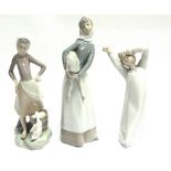 THREE LLADRO FIGURES: a young girl with lamb, a girl with bucket of water and duck, and a yawning
