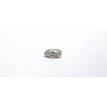 A MID 20TH CENTURY PLATINUM AND DIAMOND THREE STONE RING the graduated round brilliants approx. 0.