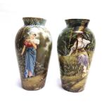 A PAIR OF CONTINENTAL BALUSTER SHAPED VASES painted decoration of maidens in landscape settings,