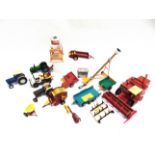 A BRITAINS FARM COLLECTION comprising tractors, other vehicles, implements, plastic animals, and