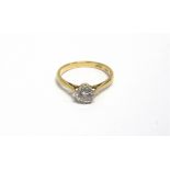 AN EARLY 20TH CENTURY GOLD AND DIAMOND SOLITAIRE RING the round brilliant approx. 0.57cts, claw