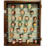 A COLLECTION OF TWENTY-FIVE ROYAL DOULTON MINATURE CHARACTER JUGS in a bespoke hanging display