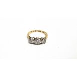 A MID 20TH CENTURY GOLD AND DIAMOND THREE STONE RING the graduated round brilliants approx. 0.35cts,