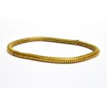 A VICTORIAN GOLD 'GASPIPE' LINK NECKLACE With a simple push-in snap, approx. 6mm diameter, 36cm long