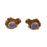 A PAIR OF MODERN 9CT GOLD AND MOONSTONE STUD EARRINGS each of abstract cartouche-shaped outline