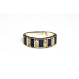 A SAPPHIRE AND DIAMOND HALF-ETERNITY RING The tapering band set with five rectangular step-cut