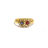 A VICTORIAN 18CT GOLD, SAPPHIRE, RUBY AND HALF-PEARL ENTWINED TWIN HEARTS RING the small cushion-