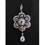 A VICTORIAN DIAMOND HEXAFOIL PENDANT WITH A PEAR-SHAPED DIAMOND DROP cut-away collet set