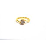 AN 18CT GOLD AND DIAMOND SOLITAIRE CROSS-OVER RING the round brilliant approx. 0.15cts, claw set