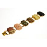 A LATE VICTORIAN GOLD AND AGATE PANEL BRACELET the six canted-rectangular panels each approx. 35mm