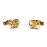 A PAIR OF MODERN 9CT GOLD CUFFLINKS, EACH IN THE FORM OF A PIG'S HEAD within open surrounds and oval