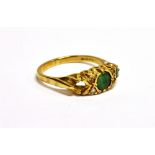 AN 18CT GOLD, EMERALD AND DIAMOND BOAT-SHAPED RING the two (of three) round mixed-cut emeralds