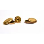 A PAIR OF LATE VICTORIAN 15CT GOLD OVAL CUFFLINKS each with two domed-oval panels and chain inter-