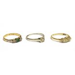 THREE DIAMOND RINGS comprising; an early-mid 20th century gold and diamond solitaire ring, the round