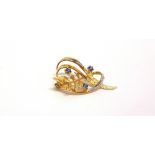 A MODERN 9CT GOLD, SAPPHIRE AND DIAMOND SPRAY BROOCH in the form of a part textured and polished