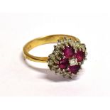 A MODERN 18CT GOLD, RUBY AND DIAMOND LOZENGE-SHAPED CLUSTER RING centred with a small diamond within