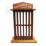 A JIFFY DYES WOODEN DISPLAY RACK 41cm high (head board slightly faded to one side; some wood-worm).