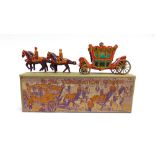 AN ENGLISH TINPLATE MODEL OF THE CORONATION COACH good condition, boxed.