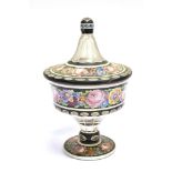 A VICTORIAN CASED AND FLASH CUT LIDDED VASE with enamelled floral decoration, 25cm high